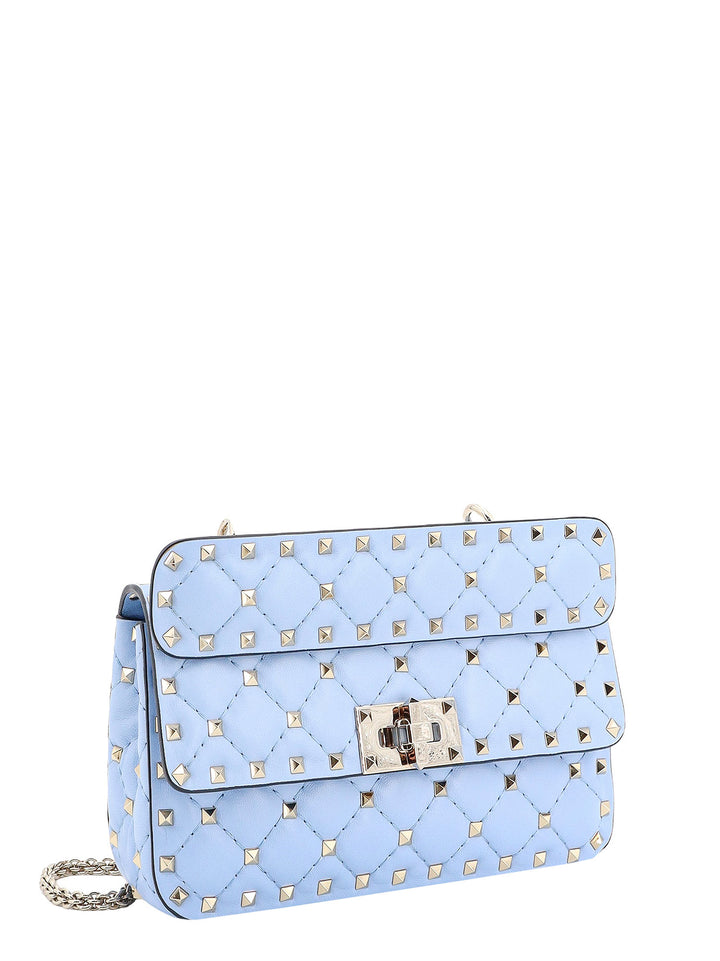 Leather shoulder bag with iconic studs