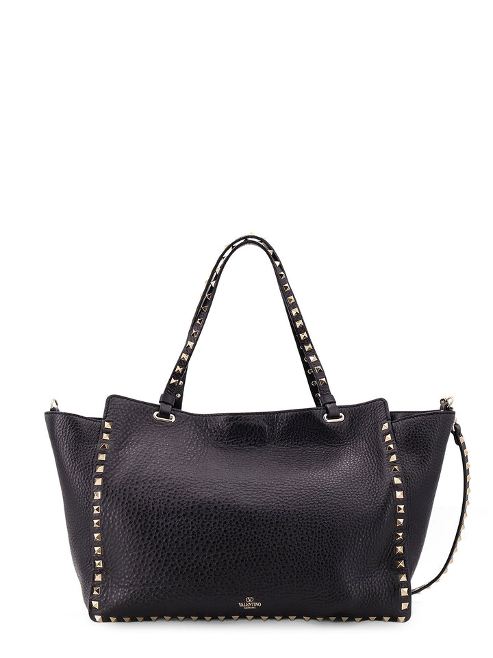 Hammered leather shoulder bag with iconic studs, metal hook closure and removable shoulder strap