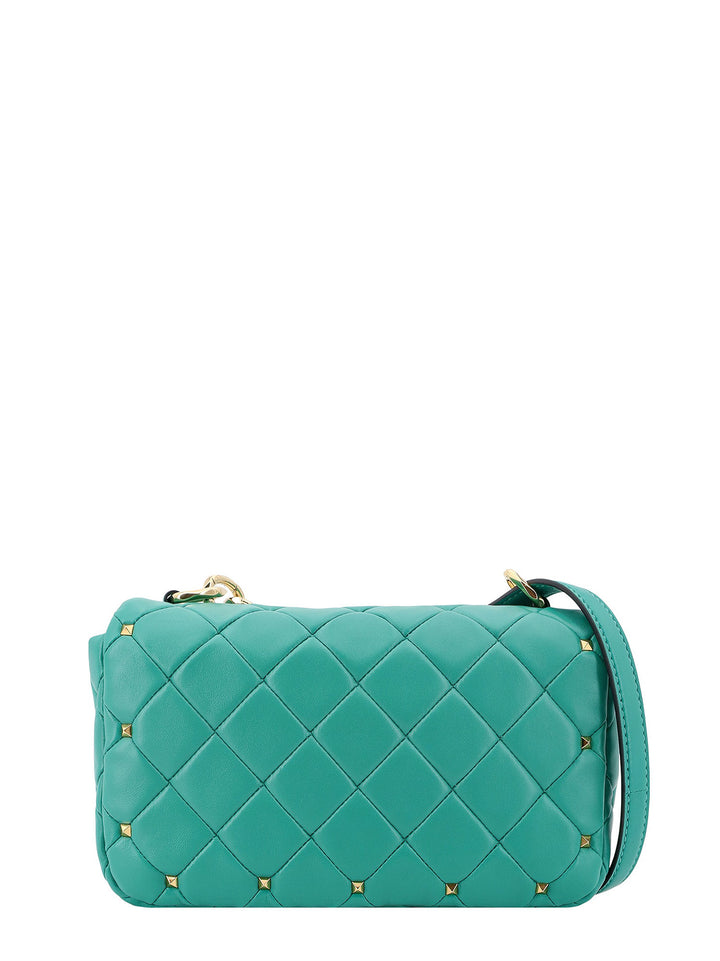 Matelassé leather shoulder bag with iconic studs