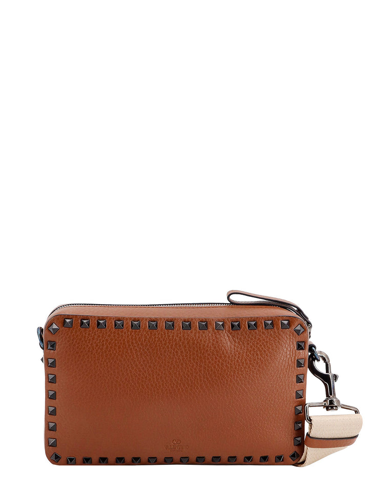 Leather shoulder bag with iconic studs