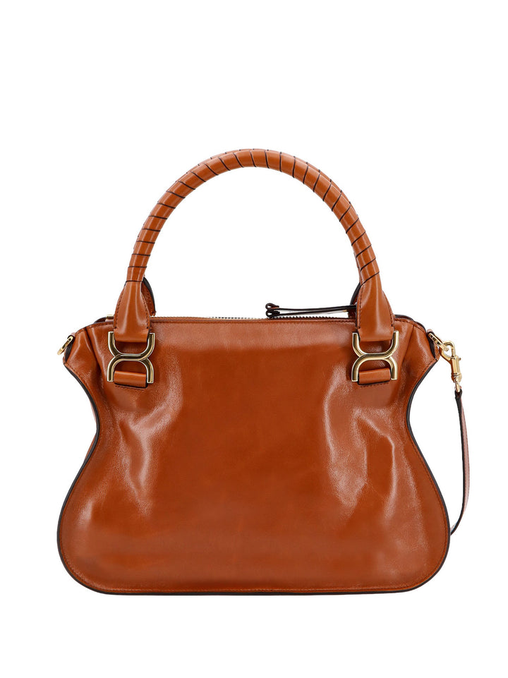 Leather handbag with engraved logo