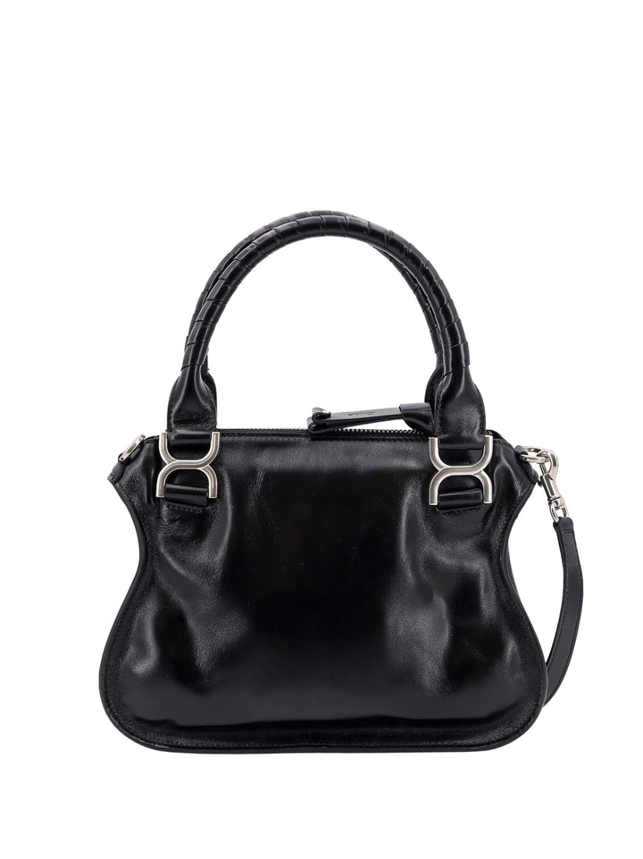 Patent leather shoulder bag with engraved logo