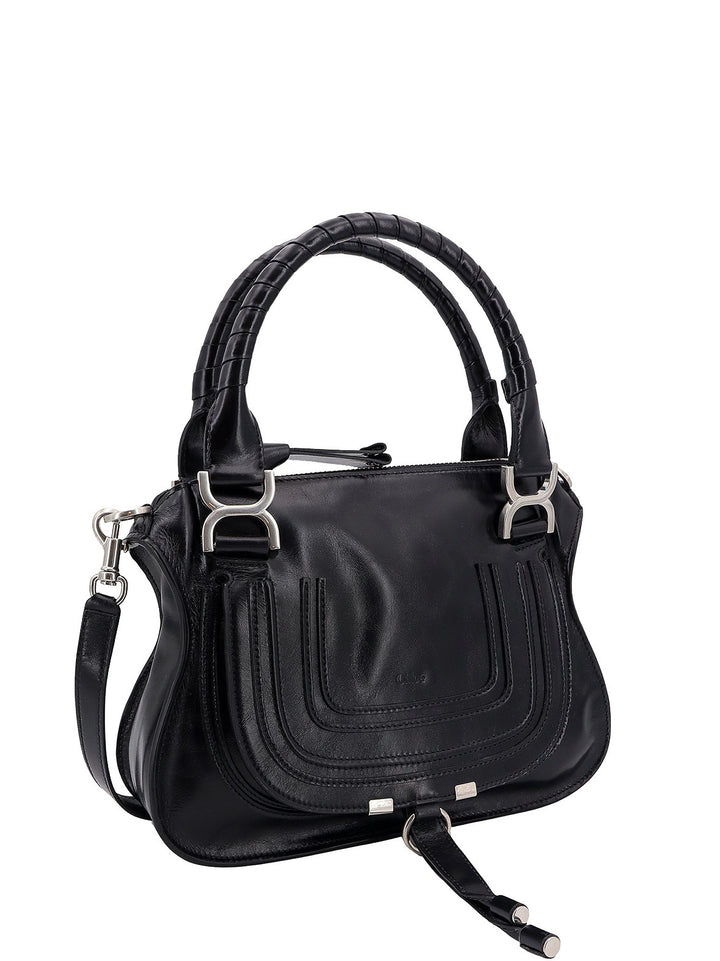 Patent leather shoulder bag with engraved logo