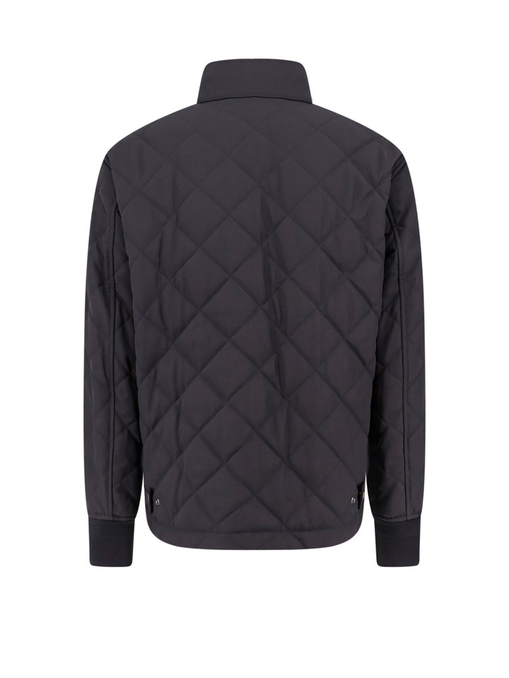 Padded and quilted nylon jacket with check lining