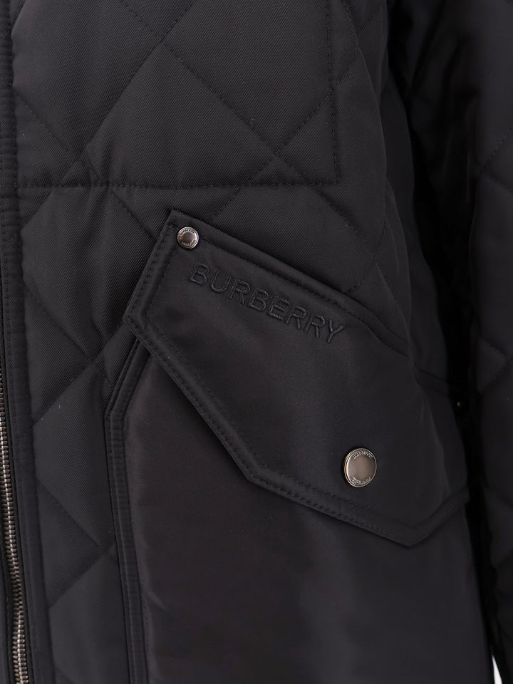 Padded and quilted nylon jacket with check lining