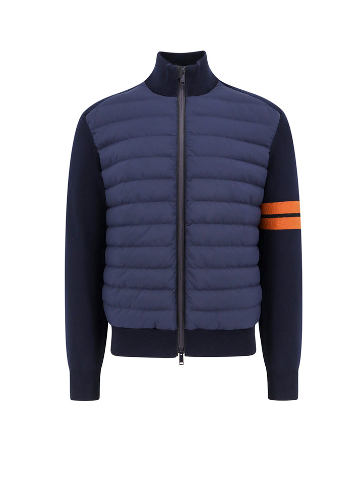 Padded and quilted jacket with knitted inserts