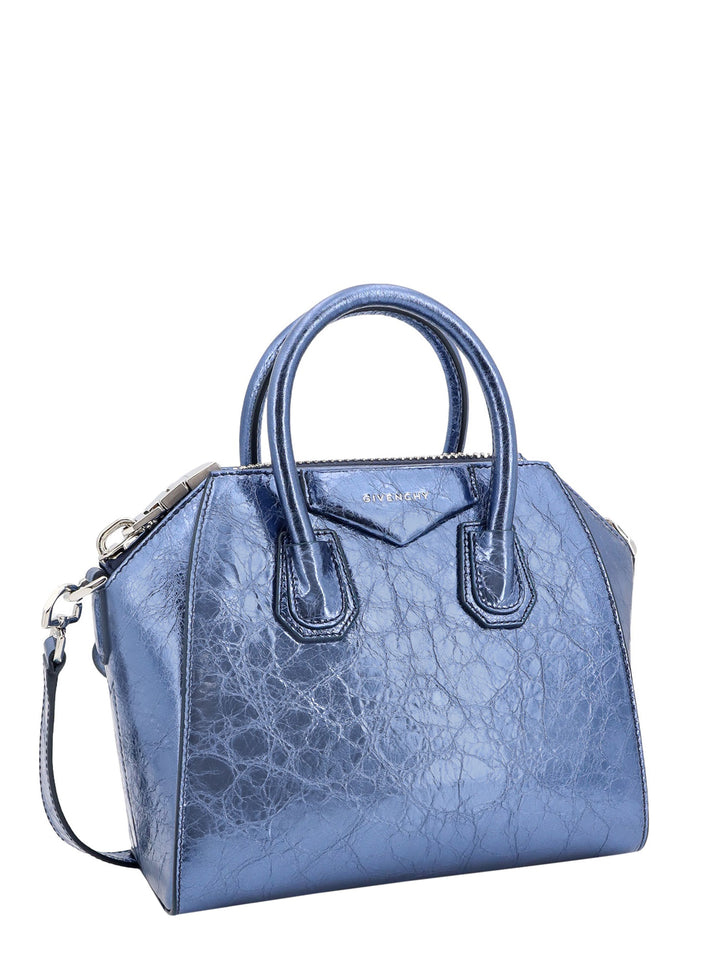 Laminated leather handbag with frontal logo