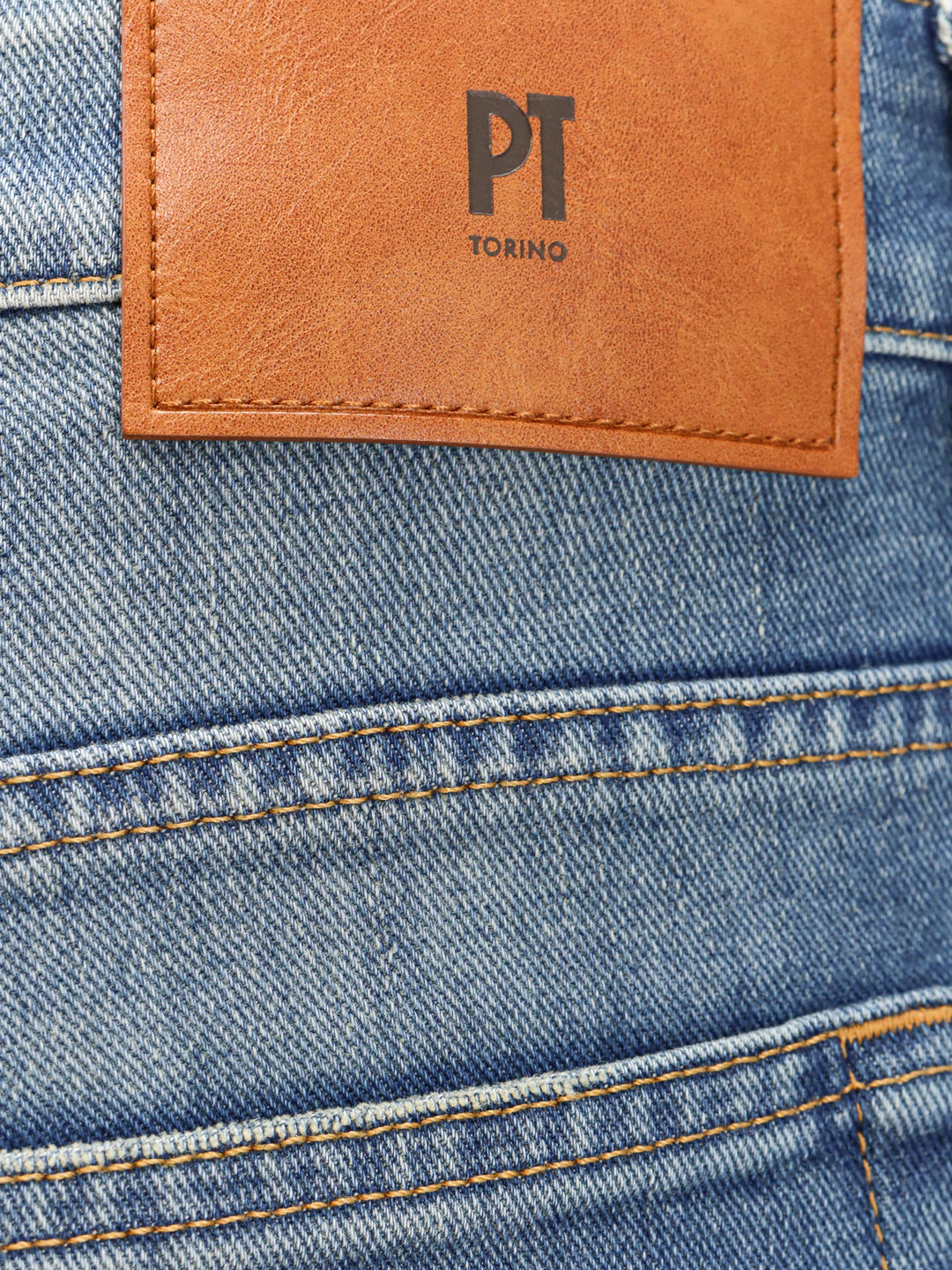 Denim jeans with back logo patch