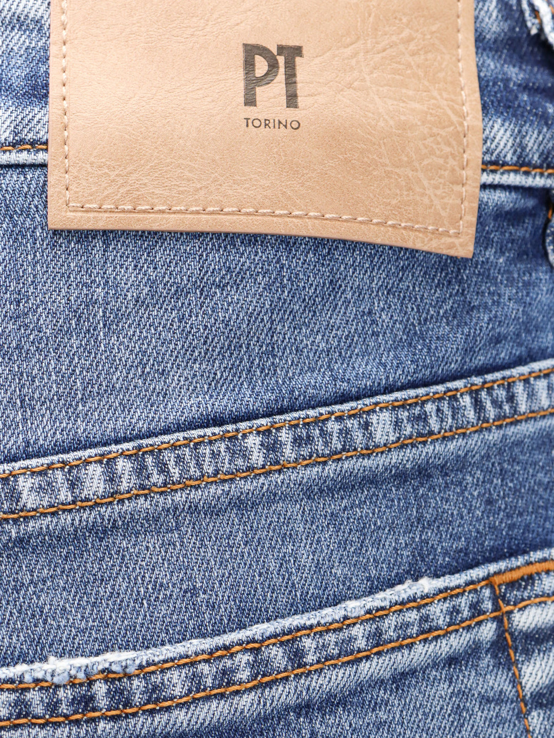 Denim jeans with back logo patch