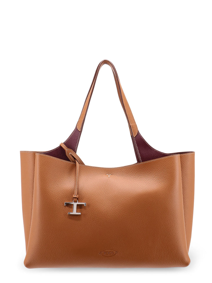 Medium leather shoulder bag with double leather handle, internal pockets and logo engraving