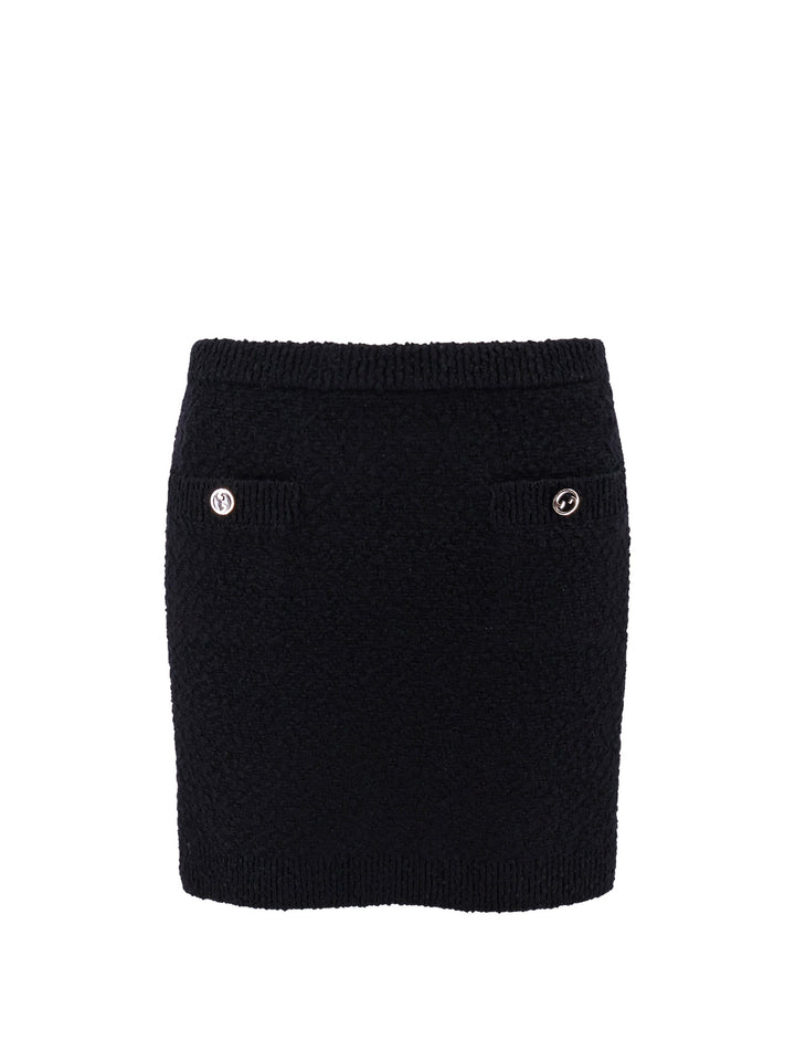 Wool skirt with bouclé effect, mini lenght and pockets with ribbed profiles and GG enamelled buttons