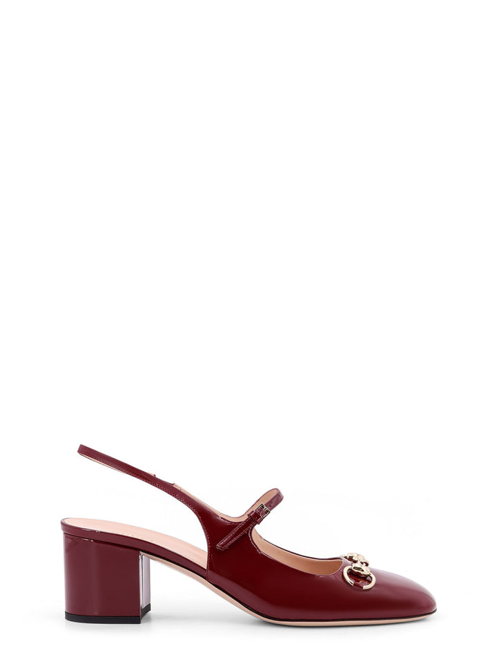 Patent leather décolleté with Iconic metal Horsebit, double strap and covered heel