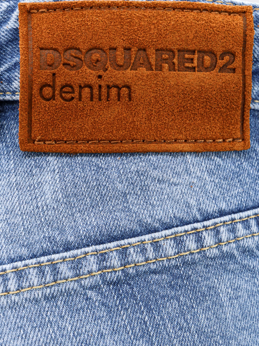 Denim jeans with suede logo patch