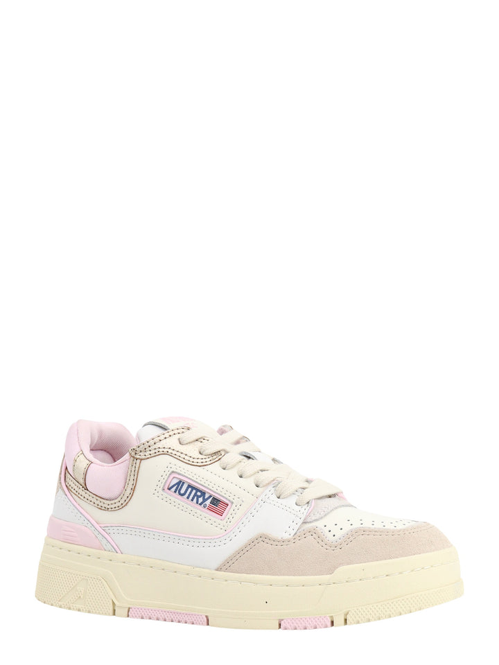 Leather and suede sneakers with pink profiles