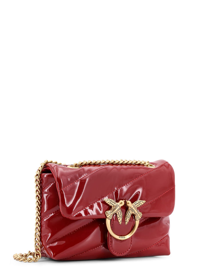 Patent material shoulder bag with Love Birds buckle