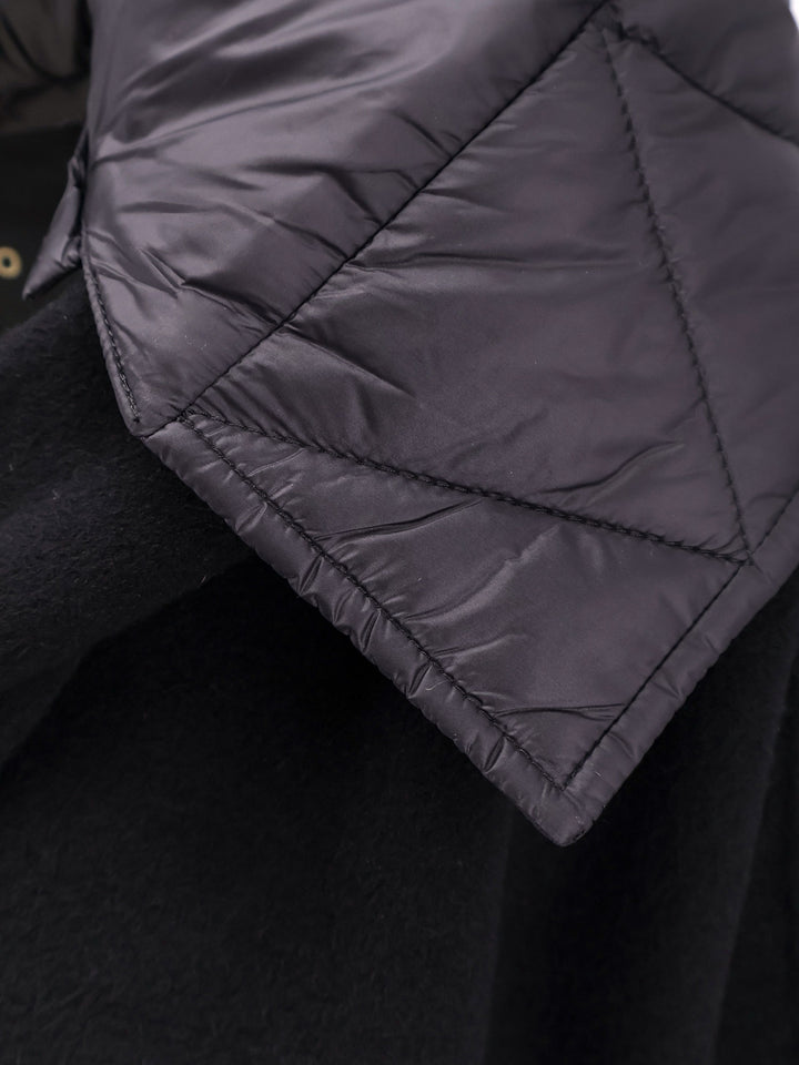 Wool coat with quilted nylon inserts