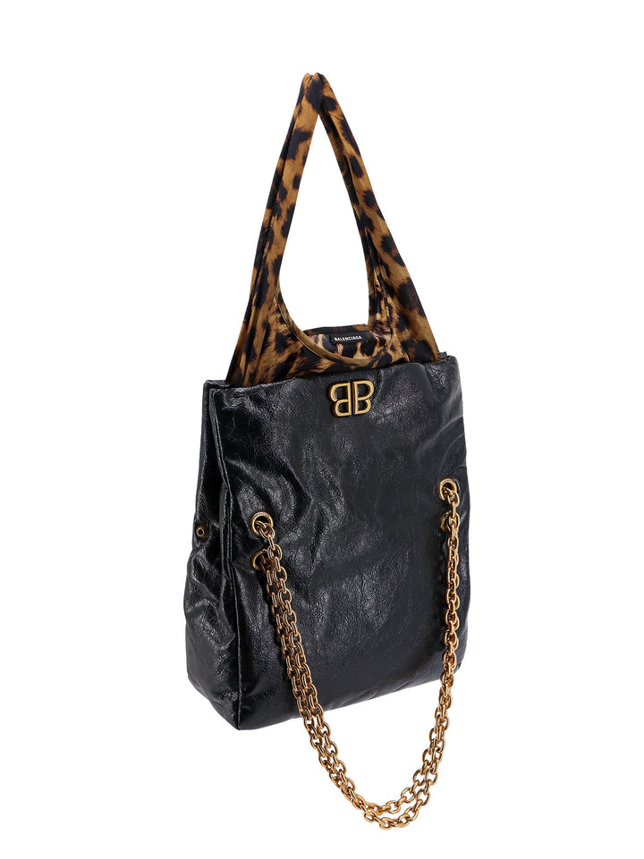 Changeable leather shoulder bag with animalier insert