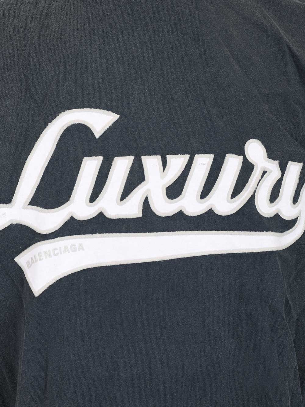 Balenciaga “Luxury Script Oversize” T-Shirt - Blue | ef96447bd1409bfbf50fcd5c856b723a720e6a63