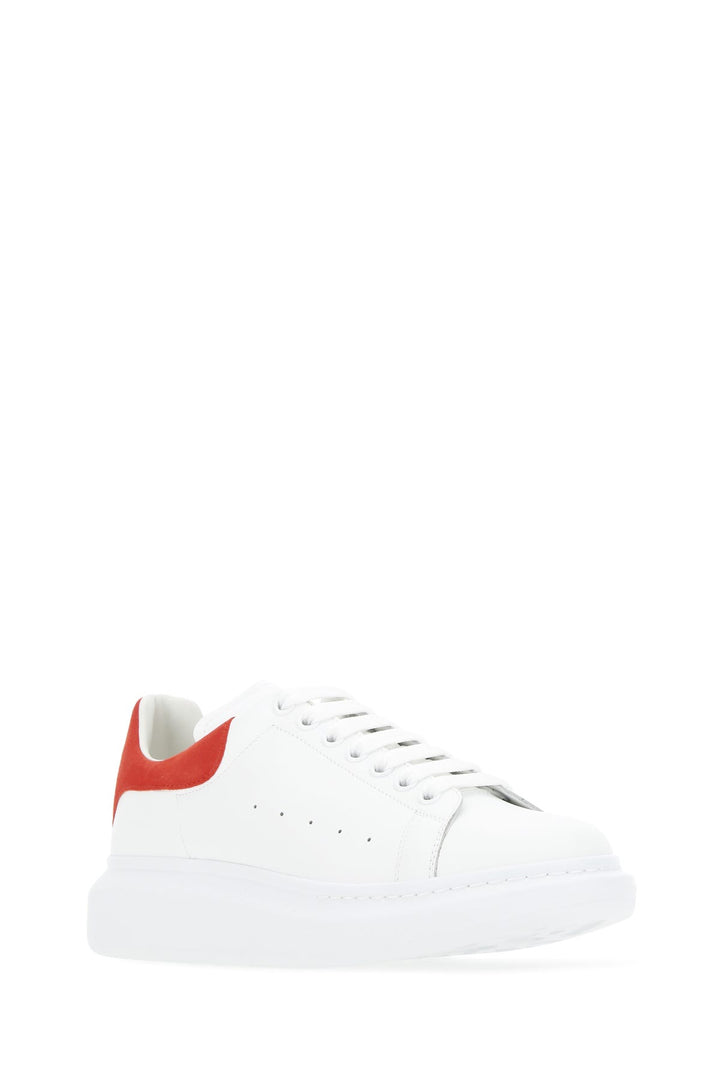 White leather sneakers with red suede heel