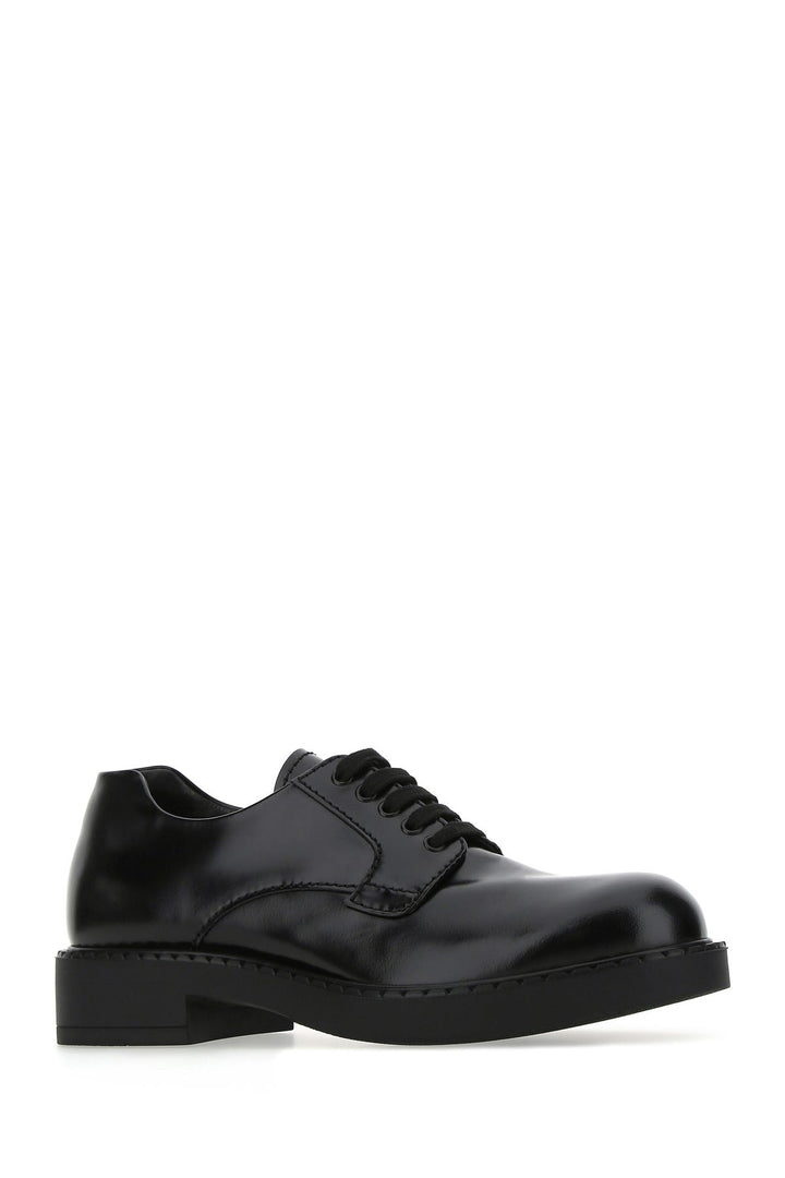 Black leather lace-up shoes