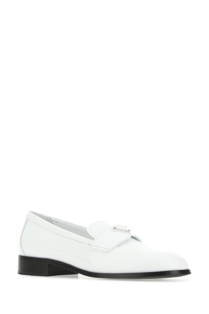 White leather loafers