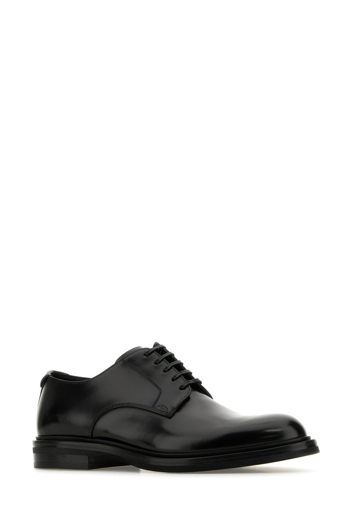 Black leather lace-up shoes