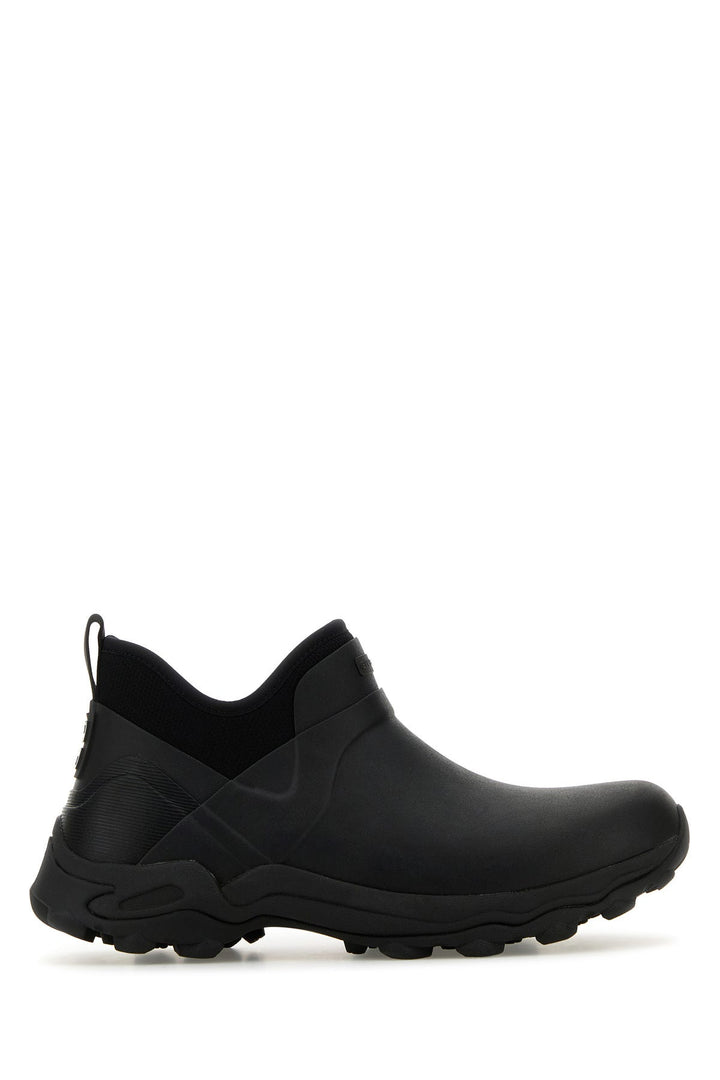 Black rubber slip ons