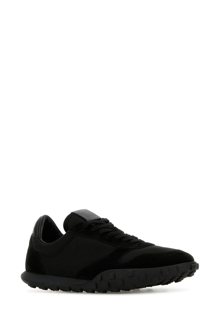 Black fabric and suede sneakers