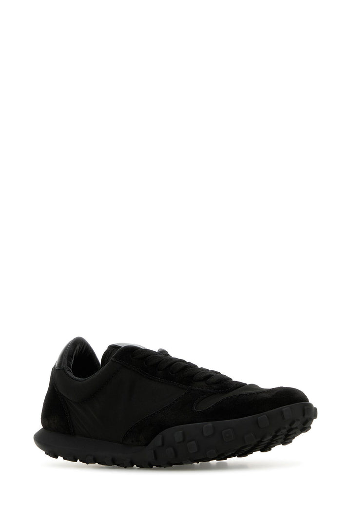 Black fabric and suede sneakers