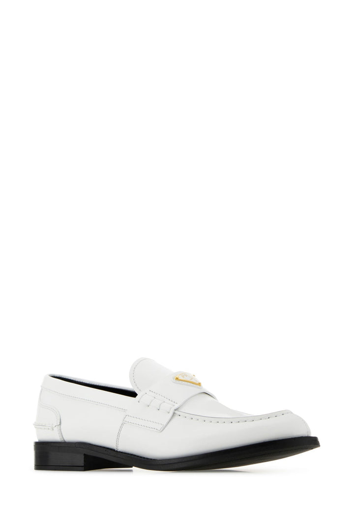 White leather loafers