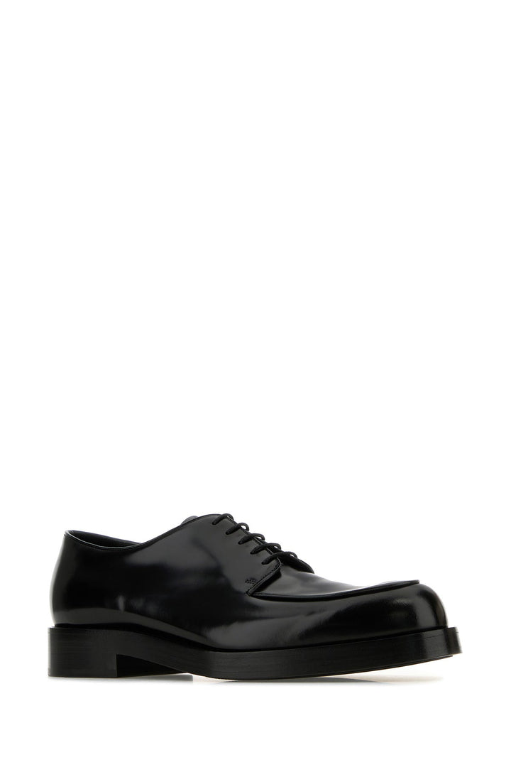 Black leather lace-up shoes