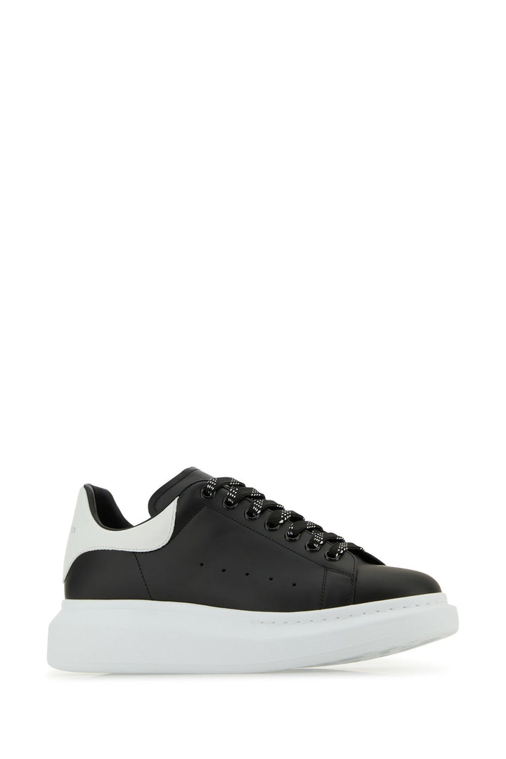 Black leather sneakers with white leather heel