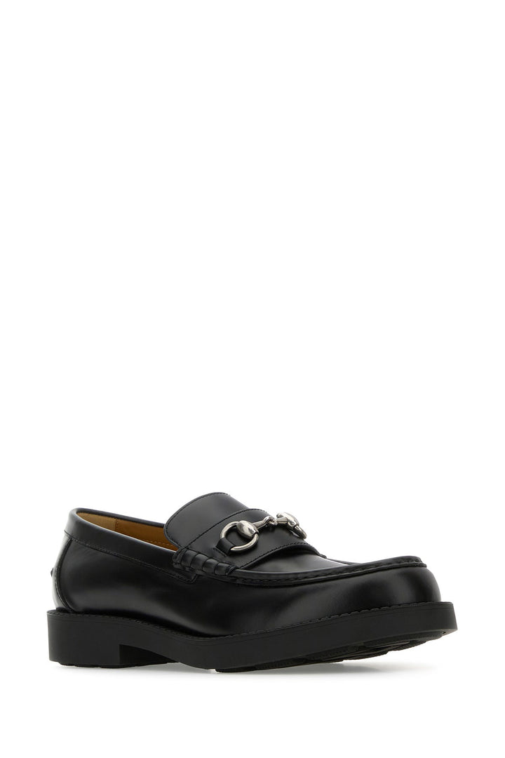 Black leather loafers