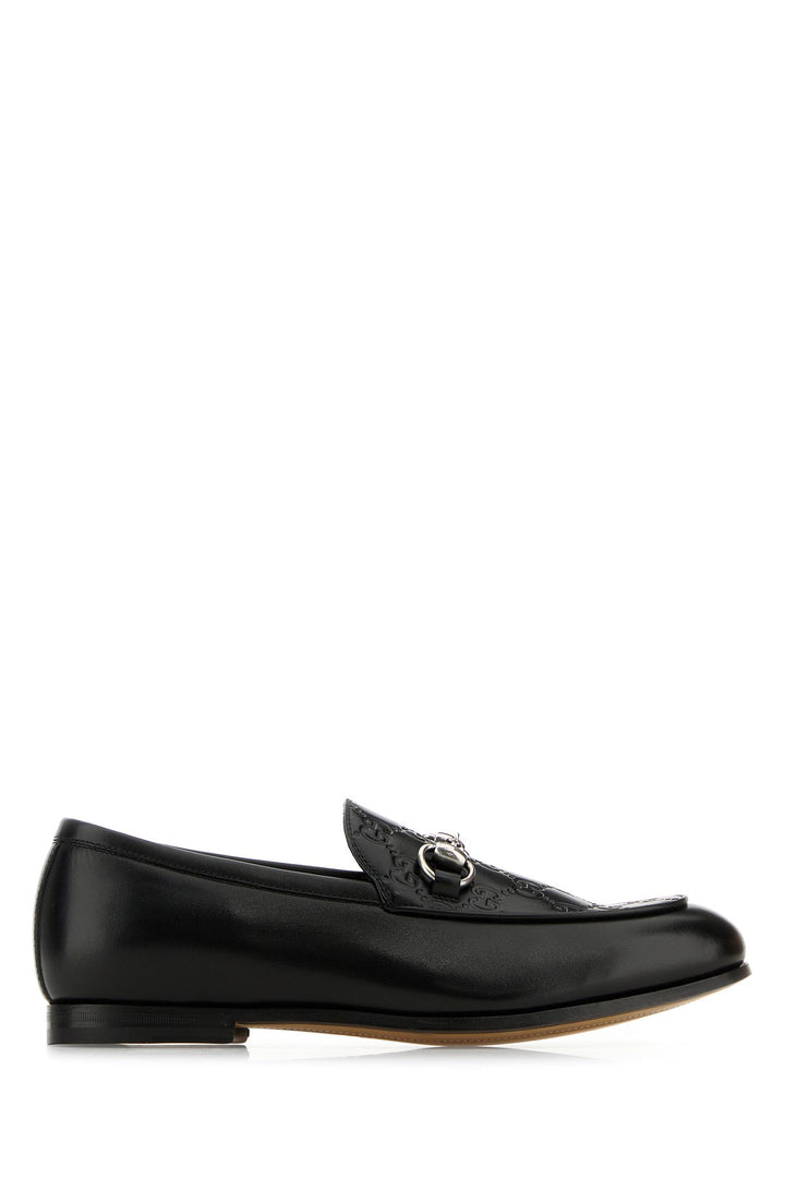 Black leather loafers