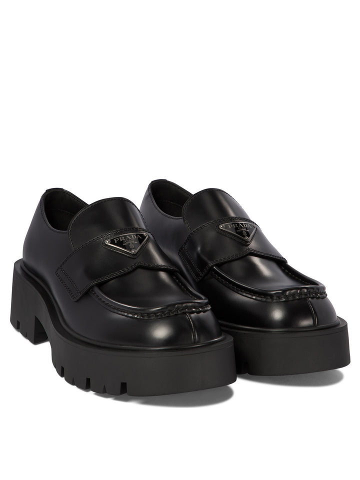 Prada Brushed Leather Loafers Loafers & Slippers - Black | 29549ca4ab3883552fe771df2fc5f55e41d07b0b