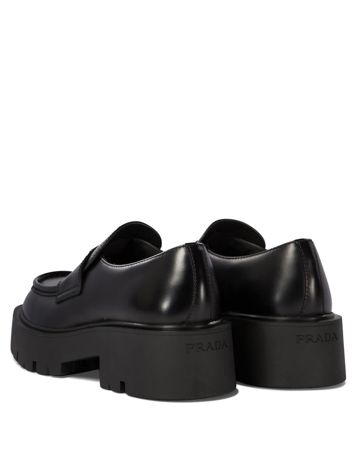 Prada Brushed Leather Loafers Loafers & Slippers - Black | 3569766e8005ae4cbfc0f5efc31e7c635c28b23f
