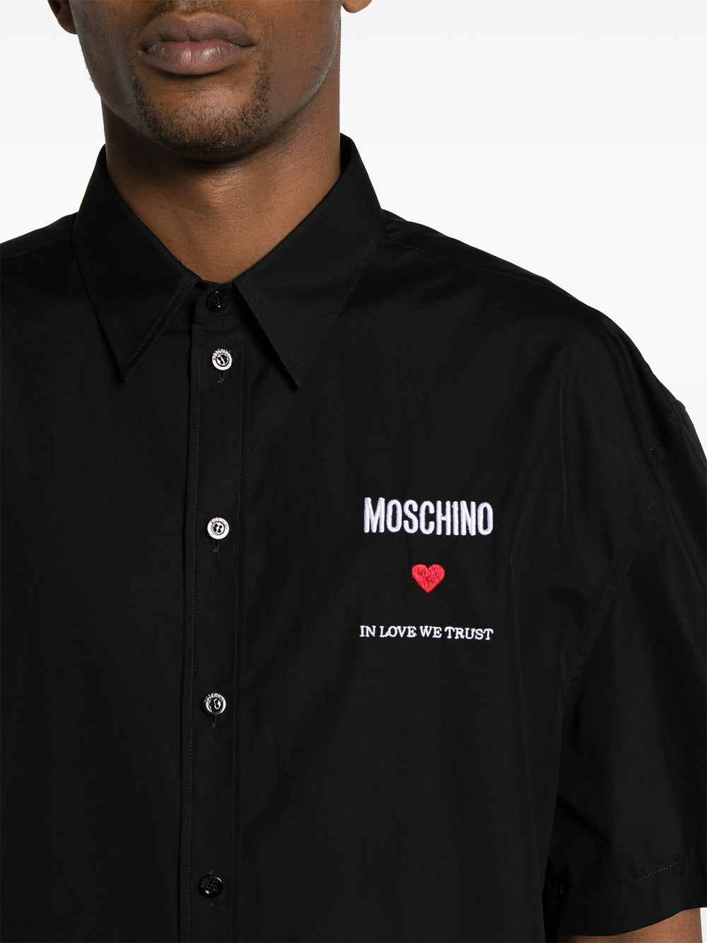 Shirt with embroidered slogan