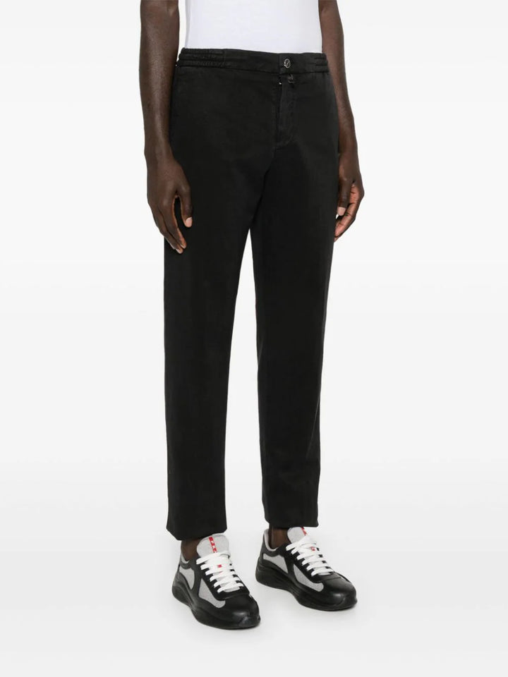 Slim fit trousers with raw cut hem