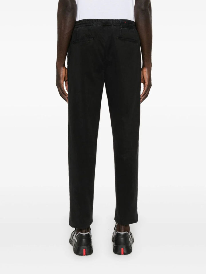 Slim fit trousers with raw cut hem