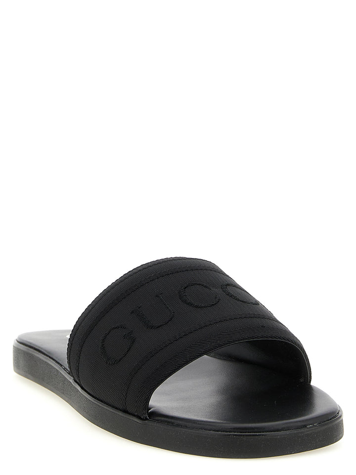 Gucci Jacquard Logo Slides Sandals - Black | e208f7678c35bfd19fb9d7a76c32c3c169d9a5d1