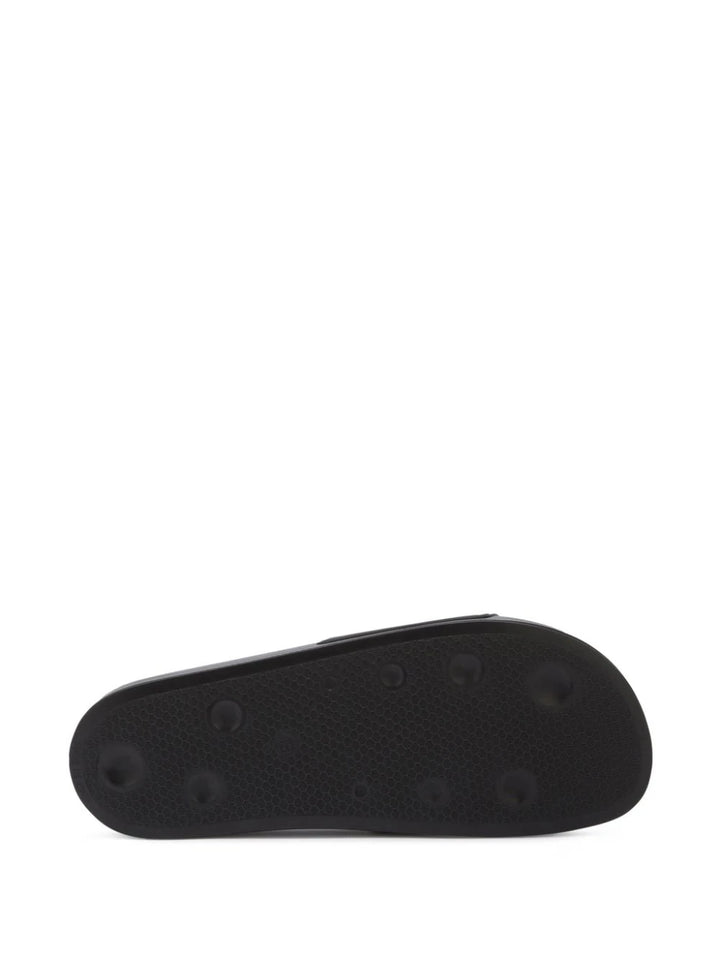 Slide sandals with embossed logo