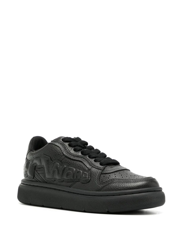 Sneakers with embossed logo