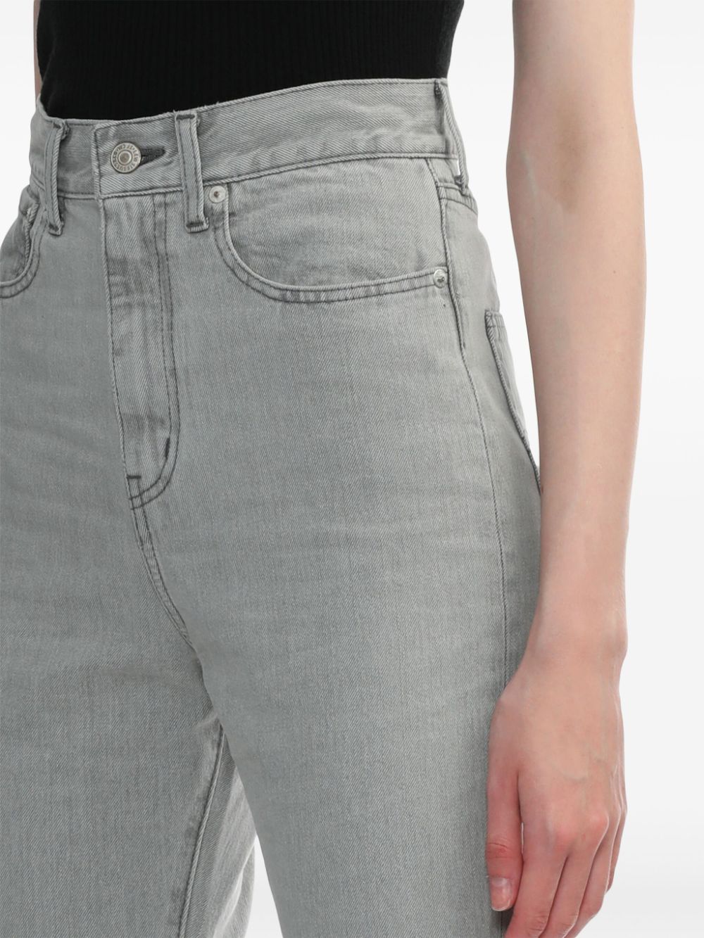 Flared jeans with a worn effect