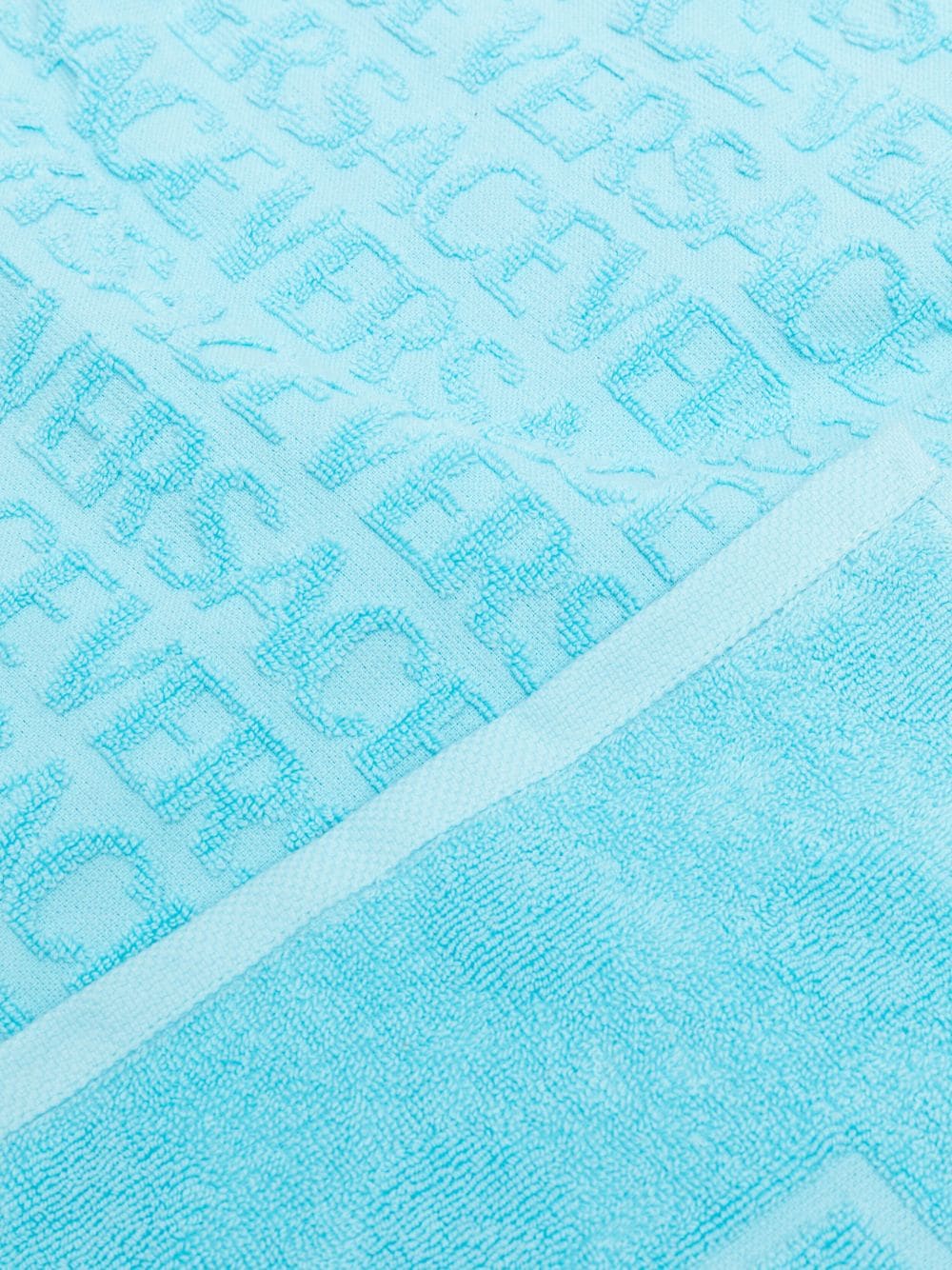 Towel with jacquard logo