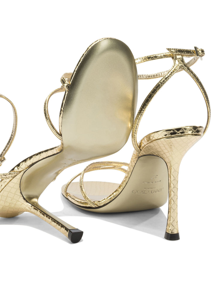 Jimmy Choo Leo 100mm Sandals - Gold | c99faa685a7b48ca4c397f25be67c7ccc49ad438