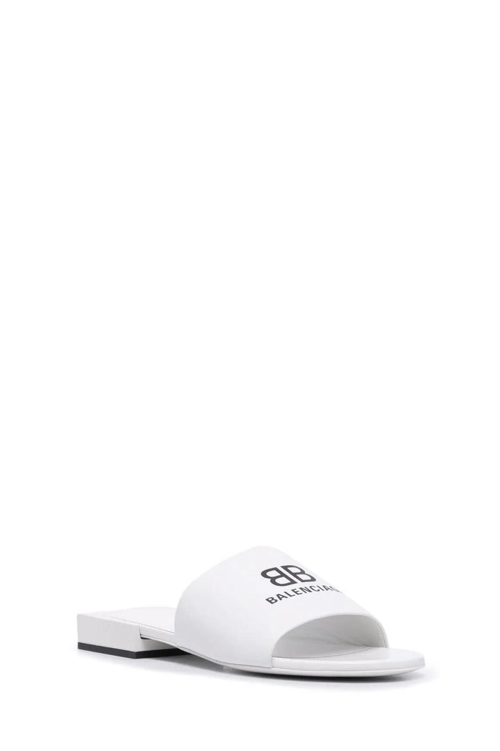 White low sandals with black logo