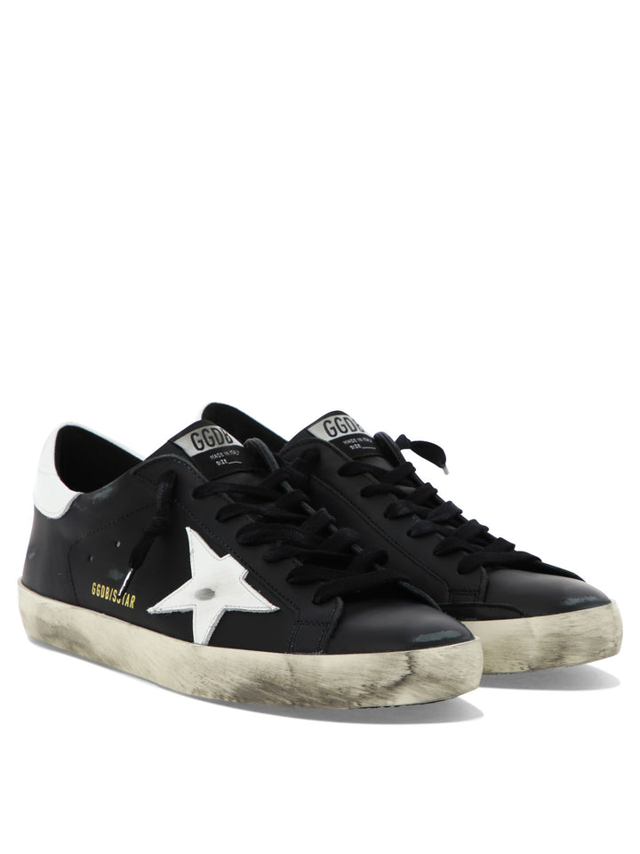 Golden Goose Super-Star Sneakers & Slip-On - Black | 4093d46cae7852c0085e7b7aac816fb3626a7c25