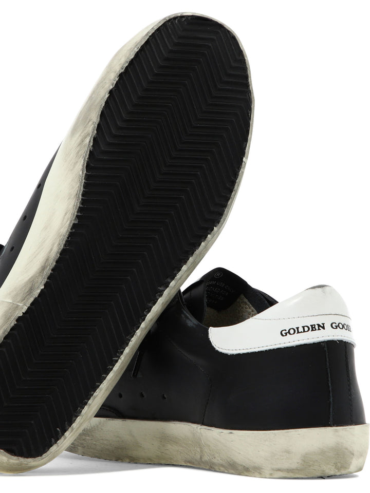 Golden Goose Super-Star Sneakers & Slip-On - Black | a16fa0c9177ae22d38677be63c1f0f63bb834106