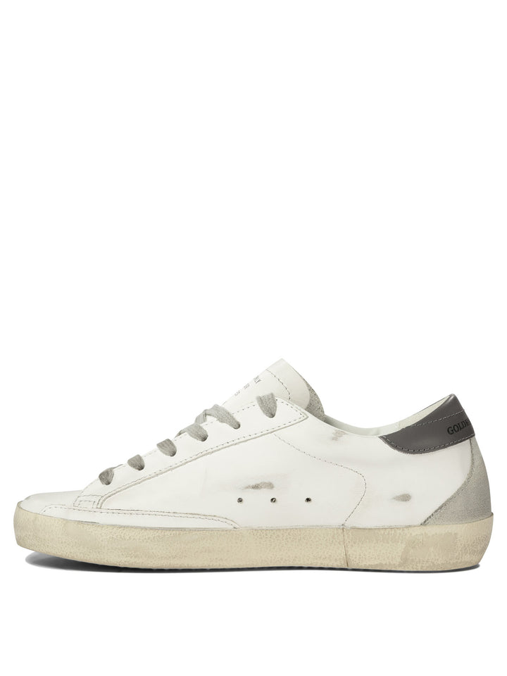 Golden Goose Super-Star Sneakers & Slip-On - White | e54eef150652327fa40ca26a6c108a44ef8543db