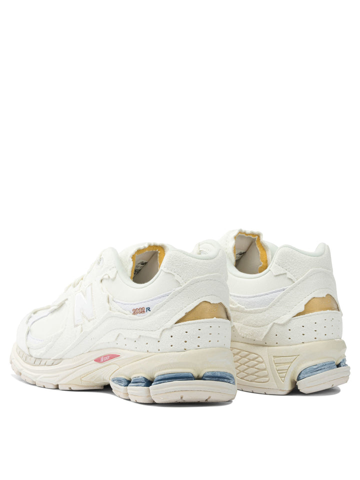 New Balance 2002r Protection Pack Sneakers & Slip-On - White | df54a57901d9a09f2ffbb628e5efe11f56888df5